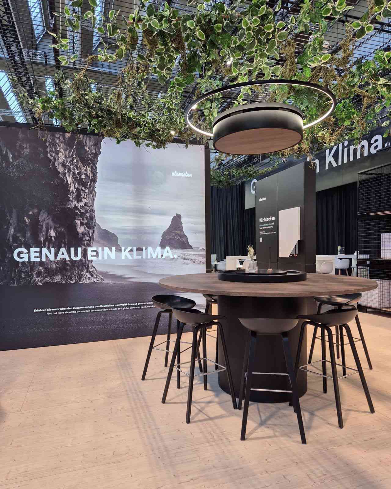 Kampmann Kadius in wood look, with light ring, installed on the Kampmann ISH 2025 exhibition stand